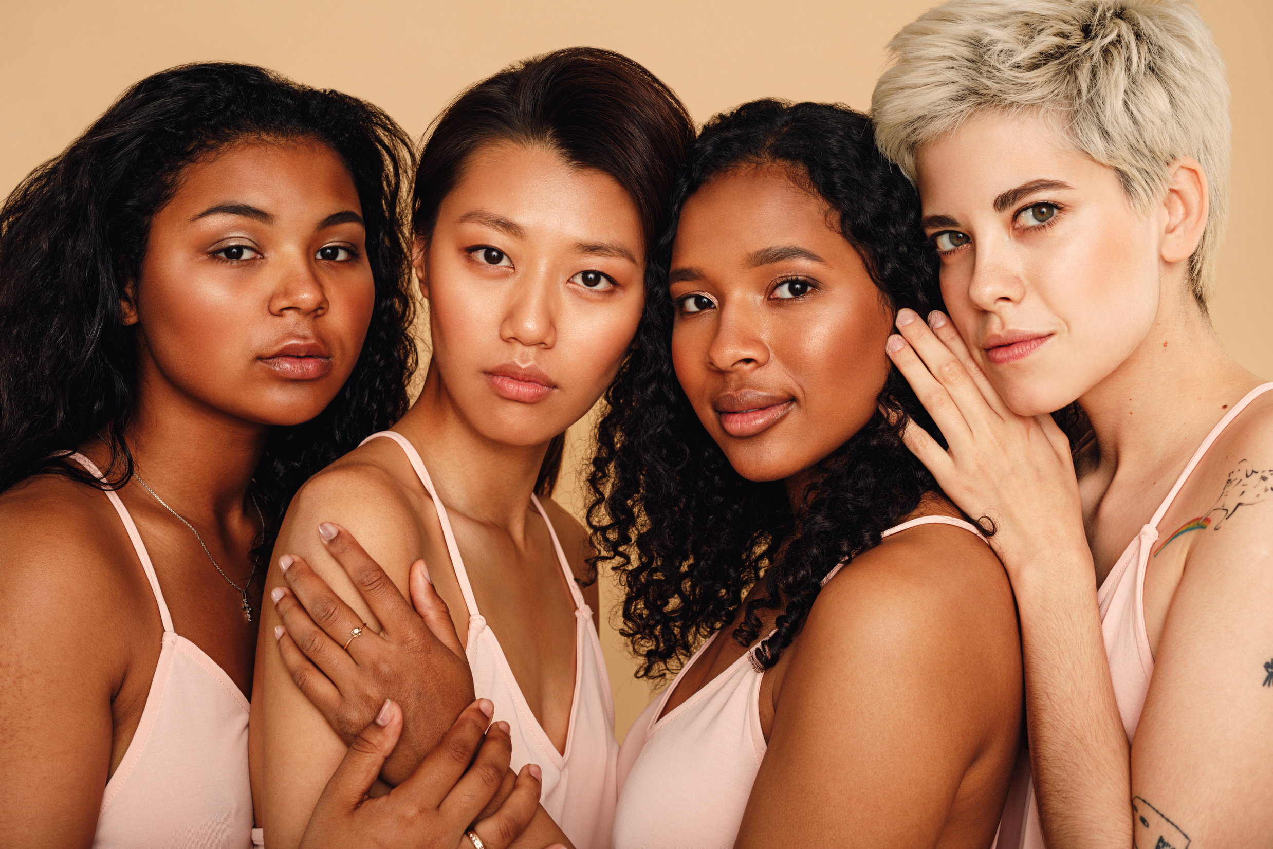Studio portrait of a four women looking at camera